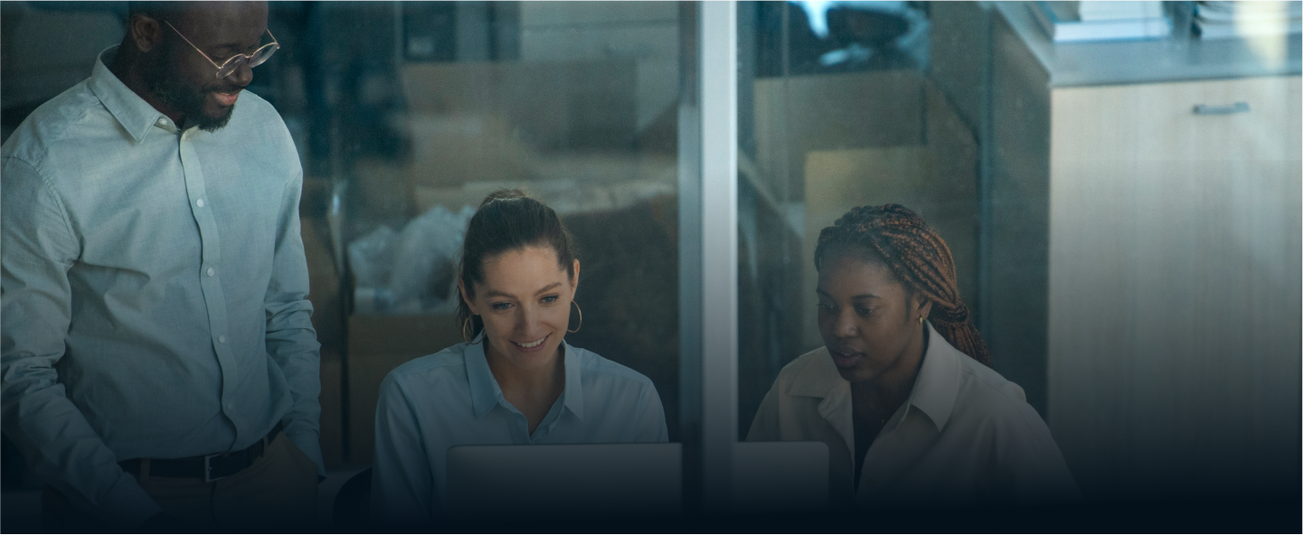 Two people smiling and talking in a modern cafe